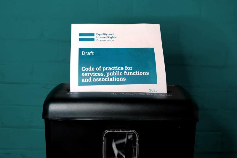 Photo of the 2025 Code of Practice feeding into a paper shredder